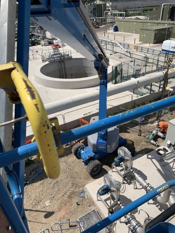 Mobile boom lift providing elevated access at a water treatment facility