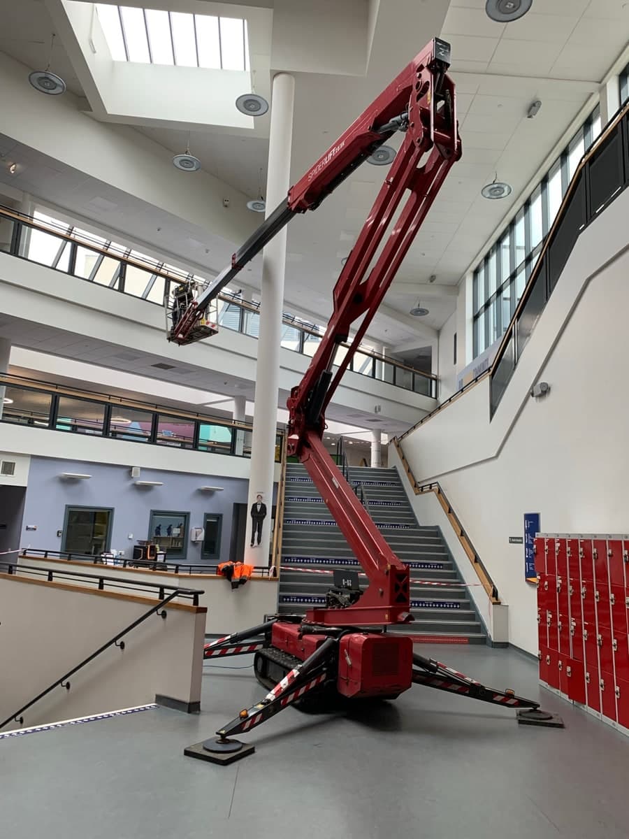 Tracked spider lift providing high-level access inside a Bradford atrium